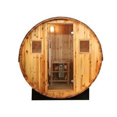 a wooden sauna is shown with the door open and light on it's side