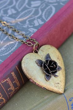 Note: I am unable to put quotes in the heart shaped vintage lockets. Thank you for understanding. This rustic heart locket is restored vintage. I added a dark bronze 3D Rose on the front. The contrast of the colors is stunning. The locket is generous, measuring 47mm! It holds two photos and the inside has a copper perimeter to hold them in tightly. It hangs on a brass chain and closes securely with a lobster clasp. Gorgeous gift or a lovely vintage accessory for you collection. It comes beautifu Vintage Heart Necklace, Rose Locket, Locket Vintage, Valentine Jewelry, Vintage Locket, Rose Heart, Heart Rose, Vintage Lockets, 3d Rose