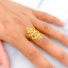 This Striped Cutwork oval ring, beautifully crafted from 22k gold and weighing 2.3 grams, showcases a luminous yellow gold finish. Sized at 6.5, it features intricate engravings that add depth and character to the classic design. With ring sizing available, it ensures a personalized fit for any wearer. Ideal for those who appreciate the elegance of traditional craftsmanship combined with the timeless value of gold, this ring offers a unique blend of artistry and sophistication, making it a distinguished addition to any jewelry collection. Product Details Gold Purity(karat): 22k Gold Weight(grams): 2.3 Item Finish: Yellow Gold Ring Size: ﻿6.5﻿ Ring Sizing Available: Yes // Heirloom Gold Oval Rings, Gold Oval Engraved Ring For Ceremonial Occasions, Gold Oval Engraved Ring For Wedding, Oval Etched Yellow Gold Signet Ring, Ceremonial Oval Gold Signet Ring, Luxury Gold Oval Engraved Ring, Heirloom Style Gold Oval Dome Ring, Gold Oval Engraved Ring With Polished Finish, Oval Engraved Ring With Polished Finish In Gold