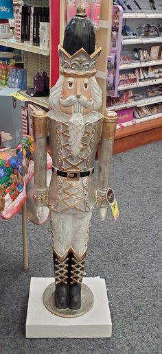 a statue of a nutcracker on display in a store