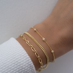 Beautiful chain bracelet that is sure to attract lots of admirers! Great for stacking or for a minimalist look! THICK, durable plating of 14k Gold or Rhodium over brass – for a piece that will be with you for years to come! Nickel-free & Hypoallergenic Available in 6.25”, 6.75”, or 7" + .5" Ext Lobster Clasp Closure Width: 4.5mm Bracelets on Model: Pave Bracelet, Cuban Link Bracelet Classy Jewelry Bracelets, Book Edits, Minimal Bracelet, Cuban Link Bracelet, Pave Bracelet, Permanent Jewelry, Gold Bracelets, Classy Jewelry, Stackable Bracelets