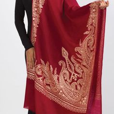 Our new Durga Embroidered Shawl features exquisite embroidery on soft 100% merino wool. With a stunning paisley design, this classically beautiful shawl showcases the intricate embroidery traditions of Northern India in rich gold tones on a burgundy red base. The high quality and elegance of these embroidered shawls make them treasures that will last for generations. Luxury Handloom Traditional Drape Shawl, Luxury Traditional Shawl Scarf, Luxury Elegant Shawl With Intricate Embroidery, Luxury Jamawar Pashmina Shawl For Traditional Ceremonies, Luxury Semi-stitched Handloom Shawl, Luxury Elegant Embroidered Pashmina Fabric, Luxury Dupatta Shawl With Motifs, Luxury Handmade Shawl For Gift, Elegant Chikankari Embroidery Scarf In Traditional Drape