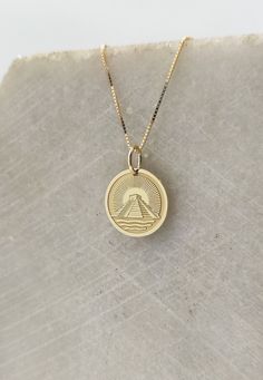 14K Real Solid Gold Necklace, Hallmarked on the back of your pendant for certification! ▪️ A beautiful and clean engraved El Castillo Pyramid   pendant made out of 14K Solid Real Gold. Available only in yellow gold! Pendant Thickness: 0.50mm Jump Ring inner diameter: 4mm Dimensions: - 13mm / 0.52 inches - 15mm / 0.59 inches - 18mm / 0.70 inches - 20mm / 0.78 inches - 22mm / 0.86 inches - 24mm / 0.94 inches Necklace Length - You can choose your chain length from 35CM to 50CM. The pendant is avail Symbolic 14k Gold Jewelry With Engraving Option, 14k Gold Etched Medallion Jewelry, Stamped 14k Gold Round Necklace, Classic Etched Jewelry For Commemoration, 14k Gold Medallion With Engraving Option Jewelry, 14k Gold Medallion With Engraving Option, Yellow Gold Jewelry With Engraving For Commemoration, 14k Gold Jewelry With Engraving Option For Commemoration, Classic 14k Gold Necklace With Engraving Option