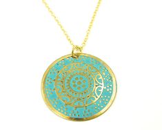 Turquoise and gold medallion necklace features a round gold disc embossed with an ornate design and colored with turquoise enamel. Pendant is 1 3/16 inches in diameter (30mm). Your choice of chain lengths - 18 or 20 inches. Find more necklace styles here - https://www.etsy.com/shop/CharleneSevier?ref=hdr_shop_menu&section_id=10084290 Blue Etched Round Jewelry, Blue Round Etched Jewelry, Patina Round Pendant Necklaces For Gift, Patina Round Pendant Necklace For Gift, Round Pendant Necklace With Patina For Gift, Turquoise Coin Pendant Jewelry As Gift, Handmade Turquoise Necklace With Round Gold Pendant, Bohemian Engraved Turquoise Necklaces, Handmade Gold Turquoise Necklace With Round Pendant