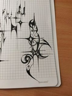 a notebook with some writing on it and an ink pen in the middle that has been drawn