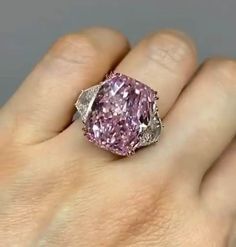 Radiant Cut pink  Moissanite Ring, Side Trapezoid Moissanite, Three Stone Engagement Ring, Claw Prongs, Wedding Ring, Bride Ring Welcome To My Shop, Great to Know You All Here. 💍 𝐑𝐢𝐧𝐠 𝐃𝐞𝐭𝐚𝐢𝐥𝐬  🔹 𝐌𝐞𝐭𝐚𝐥 𝐎𝐩𝐭𝐢𝐨𝐧𝐬:925 Sterling Silver 10 Carat/14 Carat/18 Carat Gold (Can be made in yellow/rose/white gold) 🔹 𝐒𝐭𝐨𝐧𝐞 𝐂𝐡𝐨𝐢𝐜𝐞: Moissanite  🔹 𝐒𝐭𝐨𝐧𝐞 𝐒𝐡𝐚𝐩𝐞: Radiant  🔹 𝐒𝐭𝐨𝐧𝐞 𝐒𝐢𝐳𝐞: 6 CT 🔹 𝐁𝐚𝐧𝐝 𝐒𝐡𝐚𝐧𝐤 𝐏𝐫𝐨𝐟𝐢𝐥𝐞: Designer  🔹 𝐁𝐚𝐧𝐝 𝐖𝐢𝐝𝐭? Wedding Ring Bride, Pink Moissanite Ring, Radiant Cut Moissanite Ring, Ring Bride, Bride Ring, Radiant Cut Rings, Radiant Engagement Rings, Three Stone Engagement Ring, Claw Prong