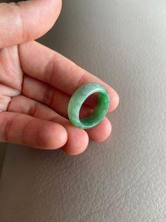 🌈 US 7 3/4 Jadeite Jade Ring, Light Green 🌷 Untreated Natural Jadeite Jade/ Grade A Jade 🌷 Certified : YES 🌷 Jade from Myanmar/ Burma 🌷 Width & Thickness : 7.5mm & 2.9mm 🌷 Sizing Ring : US7 3/4 🌷 Color : Light Green 🌷 Free standard shipping from Hong Kong with tracking included 🌷 Take approximately 7-21 days to arrive worldwide Fine Green Jade Jewelry, Handmade Green Jade Rings, Green Natural Stones Ring, Classic Green Jade Jewelry, Green Rings With Natural Stones, Round Emerald Jewelry For Healing, Emerald Rings With Natural Stones, Round Emerald Rings With Natural Stones, Green Jade Rings With Natural Stones