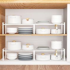 the shelves are filled with dishes and bowls