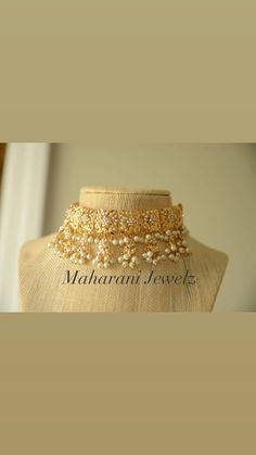 Delicate choker set with embedded pearl work in a goldplated frame. Gold Bollywood Jhumkas For Marriage, Bollywood Style Gold Jhumkas For Marriage, Elegant Gold Lehenga With Intricate Design, Gold Cutdana Necklaces For Marriage, 22k Gold Jewelry With Zari Work For Wedding, Gold Bridal Sets With Meenakari For Reception, Gold Bollywood Lehenga For Marriage, Gold Bridal Sets With Cutdana For Reception, Elegant Gold Lehenga With Stone Work