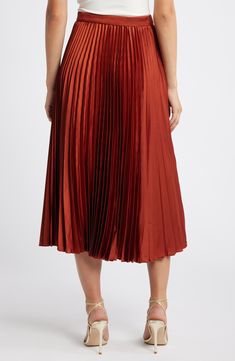 Flowy pleats add visual intrigue to a versatile skirt fashioned in a midi length for timeless appeal. 32" length (size Medium) Lined 95% polyester, 5% elastane Dry clean Imported Formal Pleated A-line Bottoms, Solid Color Midi Skirt With Accordion Pleats, Pleated Hem Midi Bottoms For Evening, Evening Pleated Hem Midi Bottoms, Evening Midi Bottoms With Pleated Hem, Evening Midi Bottoms With Pleated Waist, A-line Skirt With Pleated Back, Fitted Bottoms With Folds In Midi Length, A-line Accordion Pleated Skirt