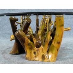 a glass top table with wooden branches on it