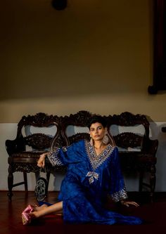 Our deep blue self-woven kaftan set showcase beautiful hand embroidery on yoke and cuffs. This elegant piece comes embellished with careful antique embroidery detailing. The soothing nature inspired woven technique details all over adds charm to this timeless outfit. Traditional Blue Silk Kurta, Bohemian Silk Kaftan With Mirror Work, Traditional Sets With Mirror Work On Tunic, Blue Bollywood Kaftan With Resham Embroidery, Bollywood Style Blue Kaftan With Resham Embroidery, Blue Embroidered Straight Kurta Kaftan, Blue Silk Long-sleeved Traditional Wear, Blue Bollywood Style Kaftan With Traditional Drape, Blue Silk Traditional Wear With Long Sleeves