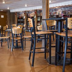 tables and chairs are lined up in a restaurant