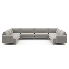 a gray sectional couch with two wooden legs and an extended back end, on a white background