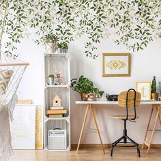 a room with a hammock hanging from the ceiling and plants on the wall