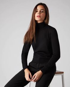 Envelop yourself in N.Peal Superfine - here in a roll neck cashmere sweater. Made from 100% Mongolian Cashmere. Available in Black. Receive complimentary delivery and bespoke wrapping on all orders. Workwear Fine Knit Funnel Neck Sweater, Fine Knit Funnel Neck Sweater For Work, High Neck Cashmere Sweater In Fine Knit, Winter Workwear Fine Knit Turtleneck, Fine Knit Turtleneck For Winter Workwear, Winter Fine Knit Turtleneck For Work, High Neck Cashmere Sweater For Work, Fitted Merino Wool Turtleneck For Fall, Elegant Stretch Cashmere Sweater