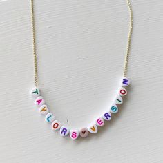 Always choose Taylor's version! You can showcase your favorite song or album with this personalized necklace! Cute little letter beads strung on either a dainty 24k gold or silver chain - perfect for any mood or outfit! Our resident Swiftie has assembled some options that perfectly depict each era for you to use as examples. {Thanks Ali!} *Personalize this necklace with your favorite song or album *This necklace measures 18" Trendy Personalized Necklaces For Personalized Gifts, Trendy Customized Necklaces For Personalized Gift, Trendy Personalized Necklaces For Gifts, Trendy Personalized Necklace For Personalized Gift, Trendy Personalized Charm Necklace Gift, Trendy Personalized Everyday Charm Necklace, Trendy Customizable Necklaces For Personalized Gifts, Customizable Trendy Necklaces For Personalized Gifts, Customized Adjustable Necklaces For Everyday