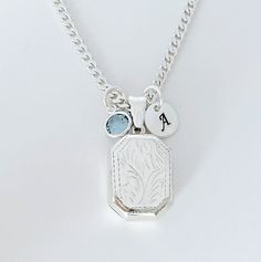 "Solid Sterling silver Locket Rectangle Necklace-  This piece will be a treasured keepsake! They're not only a trendy, stylish accessory, but also boast a rich and fascinating history.  This locket has a little bit of rim on both sides to hold two pictures in place without any glue!  The chains and Lockets I offer are solid 925 Sterling Silver Italy made, not silver or gold plated. . Take a look at other Locket designs: http://etsy.me/XKqYt8 . DESCRIPTION:  . Solid 925 Sterling silver Locket size:  20 mm L x 15 mm. . Sterling Silver disc 8mm with your chosen initial or heart 7mm upon request. . Swarovski birthstone of your choice month. . 925 Sterling Silver Italian Chains. I recommend curb chain for lockets!!   Need initials, charms, etc,? this link: http://etsy.me/UFmfXa . LOCKETS BY SHA Sterling Silver Vintage Charm Necklace For Gift, Elegant Silver Initial Pendant Locket Necklace, Elegant Silver Locket Necklace With Initial Pendant, Cheap Adjustable Silver Locket Necklace, Rectangular Etched Jewelry For Gifts, Silver Initial Pendant Locket Jewelry, Silver Sterling Charm Necklace With Detachable Pendant, Silver Charm Necklaces With Vintage Charm For Anniversary, Silver Jewelry Locket With Initial Pendant