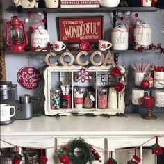 christmas decorations are displayed on shelves in the kitchen