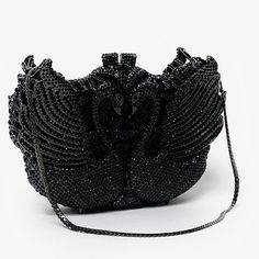 Black Swans formal evening handbag is a magnificent masterpiece perfectly covered in onyx black crystals. This stunning bag is complete with black hardware and removable black snap hook chain. This marvelous soulmate art bag can be carry in hand with or without chain. Glamorous and functional, this clutch can hold securely your keys, cards, cash and other small necessities.   Details: Measurement: 7.5in length x 5in high x 2in width Color: black crystals Lining: sliver vegan leather Closure: mag Soulmate Art, Black Swans, Prom Purse, Crystal Purse, Novelty Purses, Classic Purse, Custom Birthday Cakes, Flower Purses, Formal Evening Wear