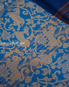 A Beautiful Blue Pure Cotton Vanasingaram Border Saree. The saree features a plain body with an elegant stiped pallu. The border on the bottom has a thread woven Vanasingaram pattern. Fall and pico are done. Does NOT come with blouse fabric.  Condition : New Fabric : Pure Cotton Blouse : No blouse fabric. Fall / Pico : Fall and pico are done. Washing : Dry clean only Occasion : Traditional, Religious , Festival, Special occasion, Party wear Note: We try to stay as accurate to the original colors Bohemian Blue Pre-draped Saree For Wedding, Bohemian Wedding Blue Pre-draped Saree, Blue Kurta With Zari Weaving In Traditional Drape, Blue Kurta With Zari Weaving For Festivals, Festive Blue Kurta With Zari Weaving, Bohemian Saree With Self Design For Traditional Ceremonies, Blue Traditional Patterns Blouse Piece For Puja, Blue Traditional Blouse Piece For Puja, Blue Handloom Sets For Puja