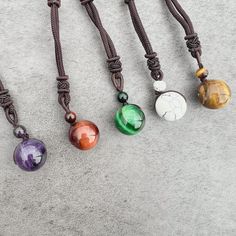 Discover the beauty, symbolism, and versatility of the Stone Sphere Rope Necklace as it becomes a unique expression of your style and connection to the energy of natural gemstones. Spheres are symbolic of completeness, unity, and the cyclical nature of life. The stone sphere on this necklace serves as a reminder of the interconnectedness of all things and the continuous flow of energy. The rope necklace is suitable for both everyday wear and special occasions. Its adjustable design and natural e Spiritual Round Agate Crystal Necklace, Spiritual Agate Crystal Necklace, Spiritual Agate Round Pendant Crystal Necklace, Spiritual Agate Crystal Necklace With Round Pendant, Agate Round Pendant Necklace For Healing, Agate Round Pendant Crystal Necklace For Healing, Black Round Pendant Necklace Nature-inspired, Agate Crystal Necklace With Round Pendant For Healing, Round Crystal Amulet Necklaces For Meditation