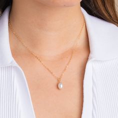 This is a beautiful and simple handmade freshwater pearl pendant necklace that looks classy with an elegant dress for your fancy night out. Wear this timeless symbol of natural power, beauty, and strength with a classic teardrop style. Elegant Pear-shaped Drop Necklace Gift, Classic Necklace With Clavicle Chain And Teardrop Pendant, Classic Clavicle Chain Necklace With Teardrop Pendant, Minimalist Teardrop Pearl Chain Drop Necklace, Classic Pearl Drop Teardrop Pendant Necklace, Dainty Teardrop Pearl Drop Necklace, Classic Necklace With Teardrop Pendant And Clavicle Chain, Minimalist Pearl Drop Teardrop Pendant Necklace, Pearl Chain Drop Necklace With Teardrop Pendant For Gift