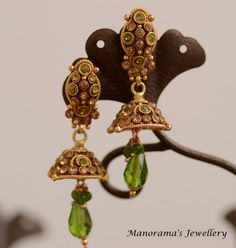 Athulya Dangle earrings - Studded with Parrot Green and Gold Zircon Crystals by ManoramasJewellery Jeweled Drop Danglers For Gift, Party Green Gold-plated Earrings, Elegant Green Crystal Earrings For Festive Occasions, Green Danglers With Latkans, Green Brass Drop Earrings, Elegant Green Drop Earrings Jhumkas, Green Crystal Drop Earrings With Dangling Beads, Green Metal Drop Clip-on Earrings, Green Crystal Metal Earrings