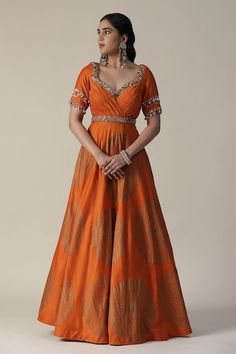 Burnt orange anarkali featuring foil printed mandala motifs, pleated bodice embellished by sequins and shell tassels. Comes with fringe lace lined dupatta. - Aza Fashions Orange Chanderi Anarkali Set For Navratri, Orange Salwar Kameez With Cutdana For Navratri, Orange Chanderi Anarkali Set With Cutdana, Semi-stitched Orange Cutdana Anarkali Set, Orange Anarkali Set With Dupatta, Festive Anarkali Style Orange Sharara, Festive Anarkali Orange Sharara, Festive Orange Anarkali Sharara, Orange Anarkali Set With Cutdana