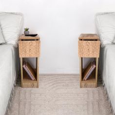 two beds side by side in a room with carpeted flooring and white walls