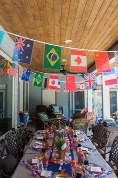 a long table is set with flags and place settings