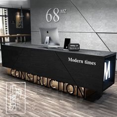 the modern times sign is displayed in front of an office desk with a computer on it