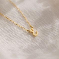 Presenting our Minimalist Initial Necklace, a personalized accessory that adds a touch of charm to any ensemble ♡ Crafted with love and attention to detail, this necklace features a dainty pendant adorned with your chosen initial, making it a perfect gift to celebrate individuality and style! Material: High Quality Solid 925 Sterling Silver Finish: Sterling Silver ∙ 18K Gold ∙ Rose Gold Dimensions: ~7mm letter height Model showcases a dainty, everyday layering look featuring our Chelsea Duo Ring Initial Tag Necklace, Figaro Bracelet, Dainty Initial Necklace, Dainty Pendant, Bar Bracelets, Birthstone Necklace, Pearl Drop Earrings, Birthstone Ring, Silver Roses