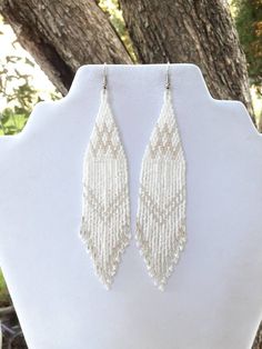 Native American Style Beaded White and Silver Wedding Earrings | Etsy White Southwestern Style Beaded Earrings For Festival, Beaded Wedding Earrings Native, Southwestern Style Beaded White Earrings, Beaded Wedding Earrings, White Fringe Beaded Dangle Earrings, Beaded Earrings Native Inspire Uplift ⭐, Melting Flowers, White And Silver Wedding, White Beaded Earrings