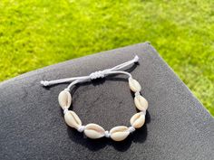 These cowrie shell bracelets and anklets look perfect for the beach! Your bracelet / anklet will come packed in a white mesh bag, complete stickers and freebies! They are fully adjustable to fit comfortably. Check out other jewellery in our shop too (bigger orders get more freebies!) We also take custom orders (through our shop page)! White Shell Bracelet For Vacation, White Strand Bracelets For Vacation, White Strand Bracelet For Vacation, White Shell Bracelets For Summer, White Shell Beachy Bracelets, Beachy White Shell Bracelets, White Shell Beachy Bracelet, White Beachy Shell Bracelet, Adjustable White Shell For Beach