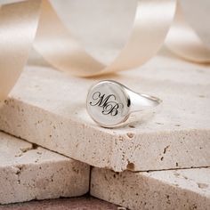 A personalised solid silver engraved initial ring makes a timeless essential piece of jewellery to treasure. A unique custom engraved solid silver signet ring that's perfect for a landmark birthday, such as 18th or 21st birthday gift for a son or grandson. The silver ring is solid silver, the back is not hollow, it's solid throughout, and hallmarked in the UK for your assurance of quality.  Initials are laid out in gently overlapping script fonts. CHOOSE YOUR FINISH Choose to have your signet ri Silver Monogram Ring For Wedding, Silver Timeless Initial Ring For Anniversary, Timeless Silver Initial Ring For Anniversary, Timeless Silver Initial Ring For Formal Occasions, Timeless Silver Signet Ring For Wedding, Silver Heirloom Initial Ring For Wedding, Timeless Silver Initial Ring, Silver Monogram Engraved Ring For Wedding, Timeless Silver Initial Ring For Wedding