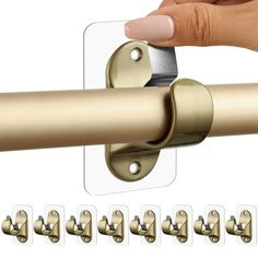 an image of a hand holding a door handle with six clips attached to the handles