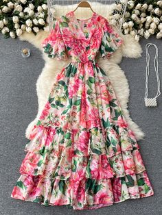 Gorgeous chiffon floral maxi dress with ruffle sleeves, ruched waist and layered ruffles at skirt. Perfect for Spring and Summer events and gatherings! Zip back closure. Fully lined. Women's sizes: S-2XL. Good things take time. Quicker shipping: This dress ships directly to you from our overseas warehouse, and will arrive in approximately 7-12 business days. Floral Long Dresses, Elegant Party Dress, Party Dress Women, Vibrant Dress, Vestidos Color Rosa, Dresses Ladies, Elegant Party Dresses, Floral Dresses Long, Beach Maxi Dress