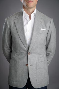 Flannel is traditionally made from a carded/woolen wool or worsted yarn. Flannel may be brushed to create extra softness like in this case, or remain un-brushed. By brushing the fabric, it creates a beautiful and sophisticated marbling you see, giving more depth to this classic light grey.

Dry-clean only. Classic White Wool Blazer, Classic Gray Wool Blazer, Timeless Gray Wool Blazer, White Poplin Dress, He Spoke Style, Grey Flannel, Dark Denim Jeans, Poplin Dress, White Solid