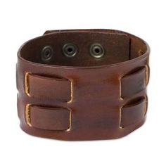 This attractive but rugged bracelet for men is crafted by hand in Thailand. The brown bracelet is designed by artisan Chaloemphon who specializes in creating stylish leather jewelry for men and women. Brass snaps secure the bracelet at one of two lengths for a comfortable fit. Modern Brown Leather Wristband, Adjustable Brown Leather Cuff Bracelet, Handmade Casual Leather Bracelets, Brown Leather Strap Wristband, Brown Leather Cuff Jewelry, Adjustable Brown Leather Bracelet With Wrist Strap, Casual Handmade Leather Bracelets, Adjustable Leather Wristband With Waxed Finish, Distressed Brown Leather Bracelets As Gift