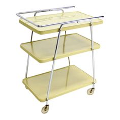 a yellow cart with two shelves and wheels on each side, one holding a tray