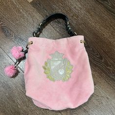 Used Good Condition Vintage Velour Bag By Juicy Couture, Light Pink, Gray Handle With Gold Hardware, Magnetic Closure, Inside Has One Zip Pocket And One Slip Pocket, Very Cute ( Some Pen Mark Inside ) Please Expect Normal Wear, ( Some Wear On Handle ) See Pictures For Additional Information. Luxury Pink Bucket Bag, Luxury Pink Top Handle Bucket Bag, Luxury Pink Bucket Bag For Travel, Luxury Pink Bucket Bag For Shopping, Designer Pink Bag With Dust Bag, Designer Pink Bags With Dust Bag, Luxury Pink Bucket Bag With Removable Pouch, Luxury Pink Shoulder Bucket Bag, Pink Top Handle Bucket Bag