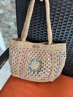 Our bag is carefully crochered from twisted natural Raffia rope. It has cotton fabric lining and 3 pockets inside. You may complete your combination with this stylish bag that will accompany you on daily use or special occasions. Measurements: 38 x23x12cm 15x9x4,7 in Strap : 59 cm (23,32 in) *Metal magnetic button closure *3 interior pockets.  *Cotton fabric Lining  * Made by hand with love and care Attention: Please do not wash, wipe gently with a damp cloth only. Casual Beige Crochet Woven Bag, Square Beige Beach Bag With Braided Handles, Beige Crochet Bag For Daily Summer Use, Square Beige Jute Beach Bag, Casual Beige Crochet Bag With Braided Handles, Summer Beige Crochet Rectangular Bag, Beige Rectangular Jute Beach Bag, Casual Cream Jute Bag, Beige Crochet Beach Bag With Braided Handles