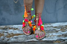 Multicolor tie up boho   leather sandals  embellished in pink ,yellow,green,orange pom poms and charms .Colourful and happy for all day long. Ideal for a perfect bohemian style. ♕ Designed to hold feet with minimal coverage and maximum stability ☀ Authentic Greek handmade ☆ Vegetable - tanned vachetta leather insole ☆ Anti-slip Italian SVIG sole ☆ Genuine leather straps ☆ Extremely flexible & lightweight - easy to walk ☆ An awesome Shoe-Box  All of our sandals are handmade in Greece in our works Bohemian Flat Lace-up Sandals For Beach, Party Open Toe Sandals With Tassels, Party Sandals With Tassels And Open Toe, Bohemian Adjustable Flat Lace-up Sandals, Bohemian Lace-up Sandals For Summer Party, Pink Open Toe Lace-up Sandals For Beach, Colorful Summer Party Sandals, Bohemian Yellow Sandals For Spring, Bohemian Handmade Lace-up Beach Sandals