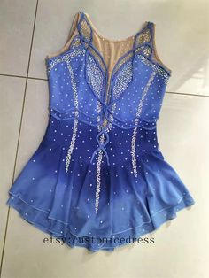 a women's leotard top with beading on the bottom and back