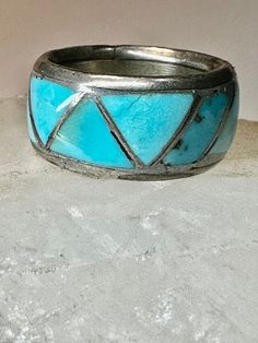 "Zuni ring Turquoise wedding band size 4.25  sterling silver women   Size  4.25 Between a size 4.25 and a size 4.50  Weight  6.2g  Width   3/8\" Free Shipping & Free/4 Postal Insurance  Delivered in a Gift Box  Free First Class shipping and postal insurance is included. If you want to upgrade to priority kindly pay an additional fee to do so.  This is recommended if you would like to have your package delivered faster than first class which has slowed down" Southwestern Inlay Jewelry For Anniversary, Southwestern Style Inlay Jewelry For Anniversary, Bohemian Inlay Jewelry For Anniversary, Unique Stackable Turquoise Ring, Turquoise Round Band Promise Ring, Southwestern 925 Stamped Jewelry For Anniversary, Southwestern Turquoise Jewelry For Anniversary, Stamped 925 Turquoise Ring For Wedding, Turquoise Round Band Ring For Anniversary