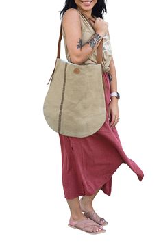 This incredibly roomy shoulder tote is crafted by artisans in Bangladesh, detailed by a row of stitches down the front and flaps of leather at the sides. The handmade jute-canvas bag meets Fair Trade standards, ensuring ethical process from start to finish. Style Name:Will & Atlas Archer Jute Tote. Style Number: 6254589. Artisan Brown Jute Shoulder Bag, Eco-friendly Jute Hobo Shoulder Bag, Eco-friendly Rectangular Jute Shoulder Bag, Eco-friendly Large Capacity Jute Shoulder Bag, Eco-friendly Handmade Burlap Shoulder Bag, Jute Totes, Shoulder Tote, Canvas Bag, Fair Trade