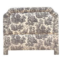 an upholstered headboard with a toiler print