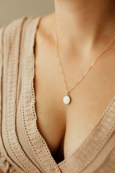 Milk + Honey — Oval Breast Milk Charm Necklace Dainty White Round Pendant Jewelry, White Initial Pendant Necklace With Delicate Chain, White Round Pendant With Delicate Chain, White Oval Jewelry With Delicate Chain, White Oval Necklace With Delicate Chain, Everyday Minimalist Cream Jewelry, Minimalist Everyday Cream Jewelry, Dainty White Charm Necklace For Bridesmaids, White Charm Necklaces For Bridesmaid Gift