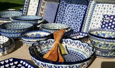 many blue and white dishes with wooden spoons